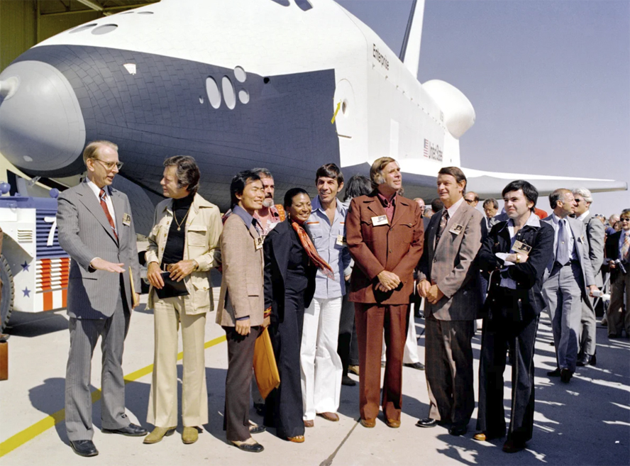 The Shuttle Enterprise rolls out of the Palmdale manufacturing facilities with Star Trek television cast members.     